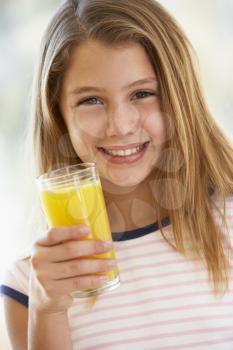 Royalty Free Photo of a Girl Drinking Juice