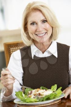 Royalty Free Photo of a Woman Eating Salad