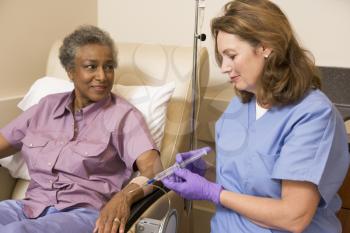 Royalty Free Photo of a Nurse Giving a Patient an Injection