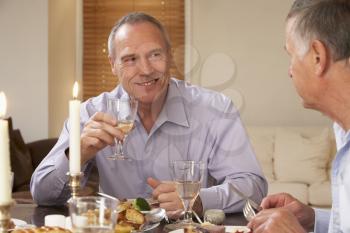 Royalty Free Photo of Two Men at a Dinner Party