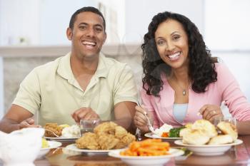 Royalty Free Photo of a Couple Eating a Meal at Home