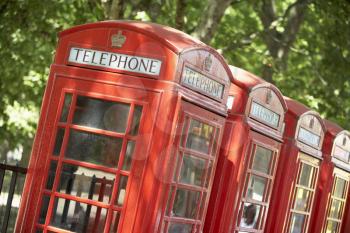 Royalty Free Photo of a Row of Red Telephone Booths