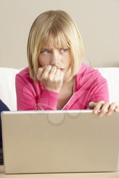 Royalty Free Photo of a Worried Girl at the Computer