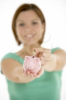 Royalty Free Photo of a Woman With a Piggybank
