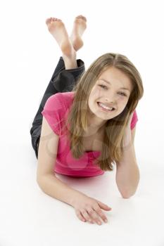 Royalty Free Photo of a Girl Lying on Her Stomach