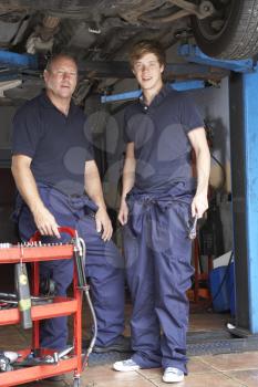 Royalty Free Photo of a Mechanic and Apprentice