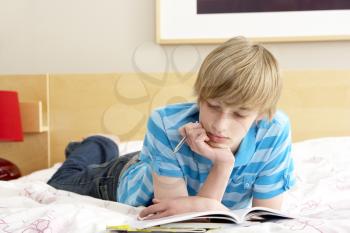 Royalty Free Photo of a Boy With a Journal