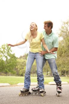 Royalty Free Photo of a Couple Roller Blading