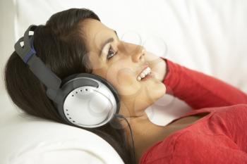 Royalty Free Photo of a Young Woman Listening to Music