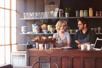 Couple Running Coffee Shop Standing Behind Counter
