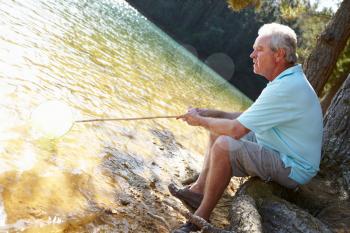 Senior man fishing at lake