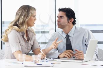 Businessman And Businesswoman Meeting In Office