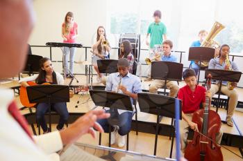 Pupils Playing Musical Instruments In School Orchestra