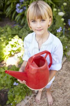 Young girl with watering can