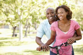Young  couple cycling in park