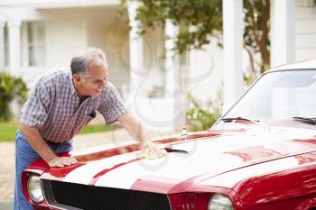 Retired Senior Man Cleaning Restored Car