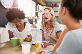 Three Female Friends Enjoying Breakfast At Home Together