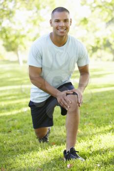 Young African American Man Exercising In Park