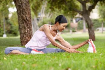 Woman exercising in park