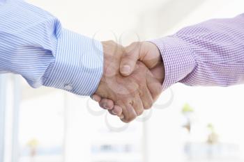 Close Up Of Two Men Shaking Hands