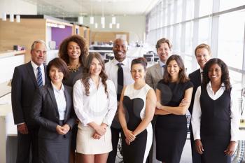 Group portrait of a team of smiling office coworkers