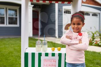 Portrait Of Girl Running Homemade Lemonade Stand