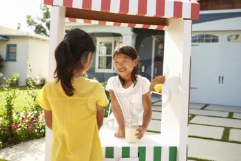 Two Girls At Home Made Lemonade Stall