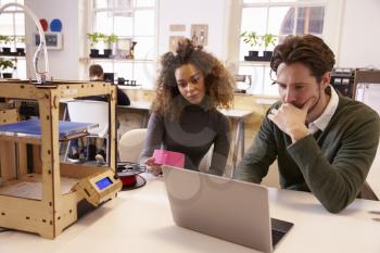 Designers Working With 3D Printer Refining Design