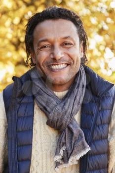 Outdoor Portrait Of Mature Man Wearing Scarf In Autumn