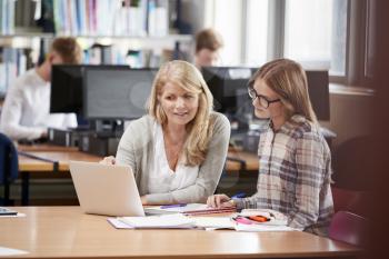 College Student Has Individual Tuition From Teacher In Library