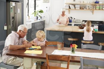 Grandparents and grandkids in family kitchen, elevated view