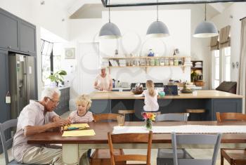 Grandparents and grandkids spending time in family kitchen