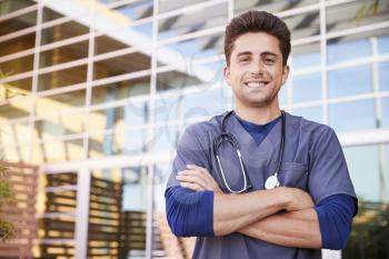Young Hispanic male healthcare worker outdoors, portrait