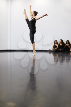 Female Ballet Student At Performing Arts School Performs For Class In Dance Studio