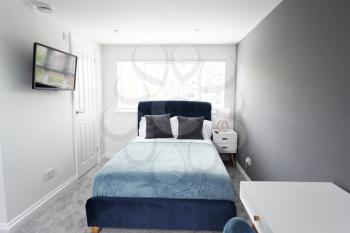 Interior of a house, bedroom, looking towards bed