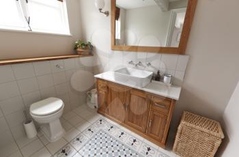 Interior View Of Beautiful Bathroom With Wash Basin And WC  In Family Home