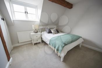 Interior View Of Beautiful Bedroom With Soft Furnishings In Family Home