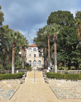 The luxurious park and marble stairs belong to Christian monastery on the Sea of Galilee