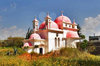  Orthodox church on coast of lake Tiberias, shined by the sun, and a church garden