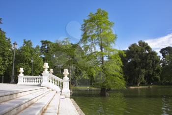 White marble ladder and lake in park Buen-Retiro in fine May day