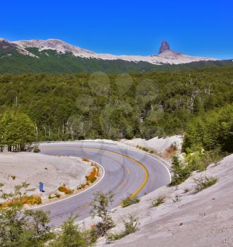 Winding road in Chilean Patagonia, covered remnants of volcanic dust