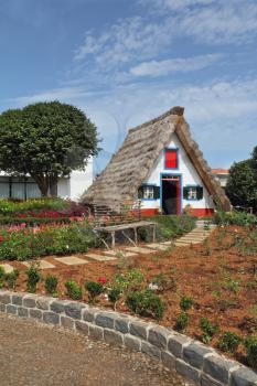 Cosy chalet with a triangular thatched roof. Madeira Island, the city Santana