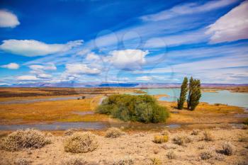 Argentine Patagonia in February. Yellow flat scorched desert with shallow lakes