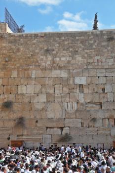 Jerusalem - October 16: The Holy Western Wall of the Temple. Thousands of Jews had gathered for morning prayers on the feast of Sukkot, October 16, 2011 in Jerusalem, Israel