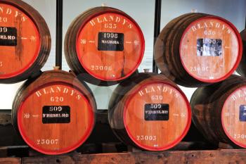 FUNCHAL, MADEIRA - OCTOBER 08, 2011: The museum - storage of expensive vintage wine Madera. Huge barrels are marked by data of wine