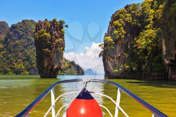 Fabulous holiday in Thailand. Bay in the Andaman Sea and tropical exotic island. A boat trip with a red lantern