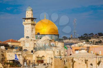  The Western Wall of the Temple  in Jerusalem. Gold dome the mosque of the Dome over Scala in Jerusalem