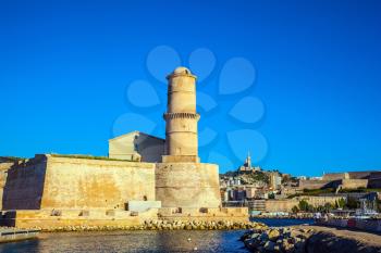 Fort St. John in Marseille. Most watchtower is reflected in the blue water port