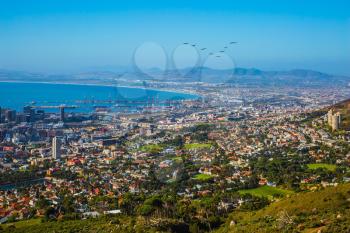 Concept of active tourism and rest. Travel to Africa. Panorama Cape Town, photographed from top of the Table mountain
