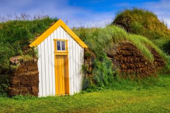  The reconstituted village - museum of the first settlers in Iceland. Roofs of houses covered with turf and grass. The village ancestors